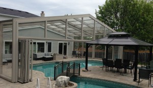 Pool Enclosure retracts over House