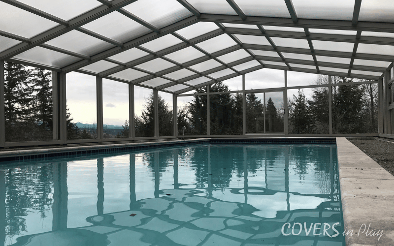 Wide view of residential backyard pool dome in Edgewood, WA