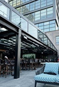 Exterior view of patio enclosure in New York City with additional seating and a secluded event space with
skyline views.