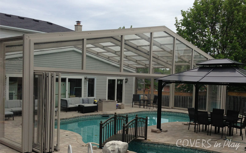 Side-angled view of residential swimming pool enclosure in Holland Landing