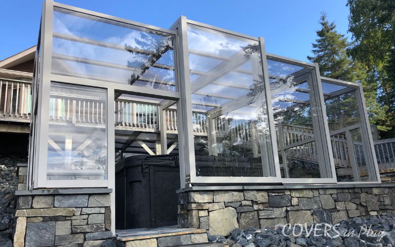 Exterior close-up of residential retractable hot tub enclosure in Kenora, ON
