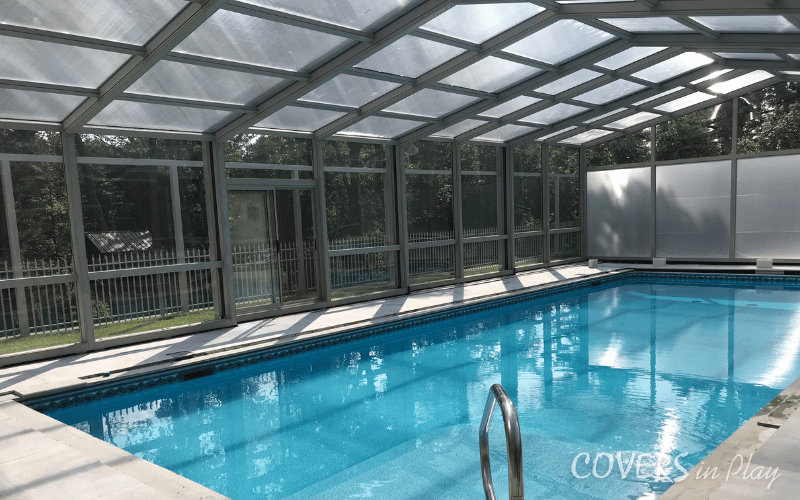 Front angled interior view of closed residential pool enclosure in Lakewood