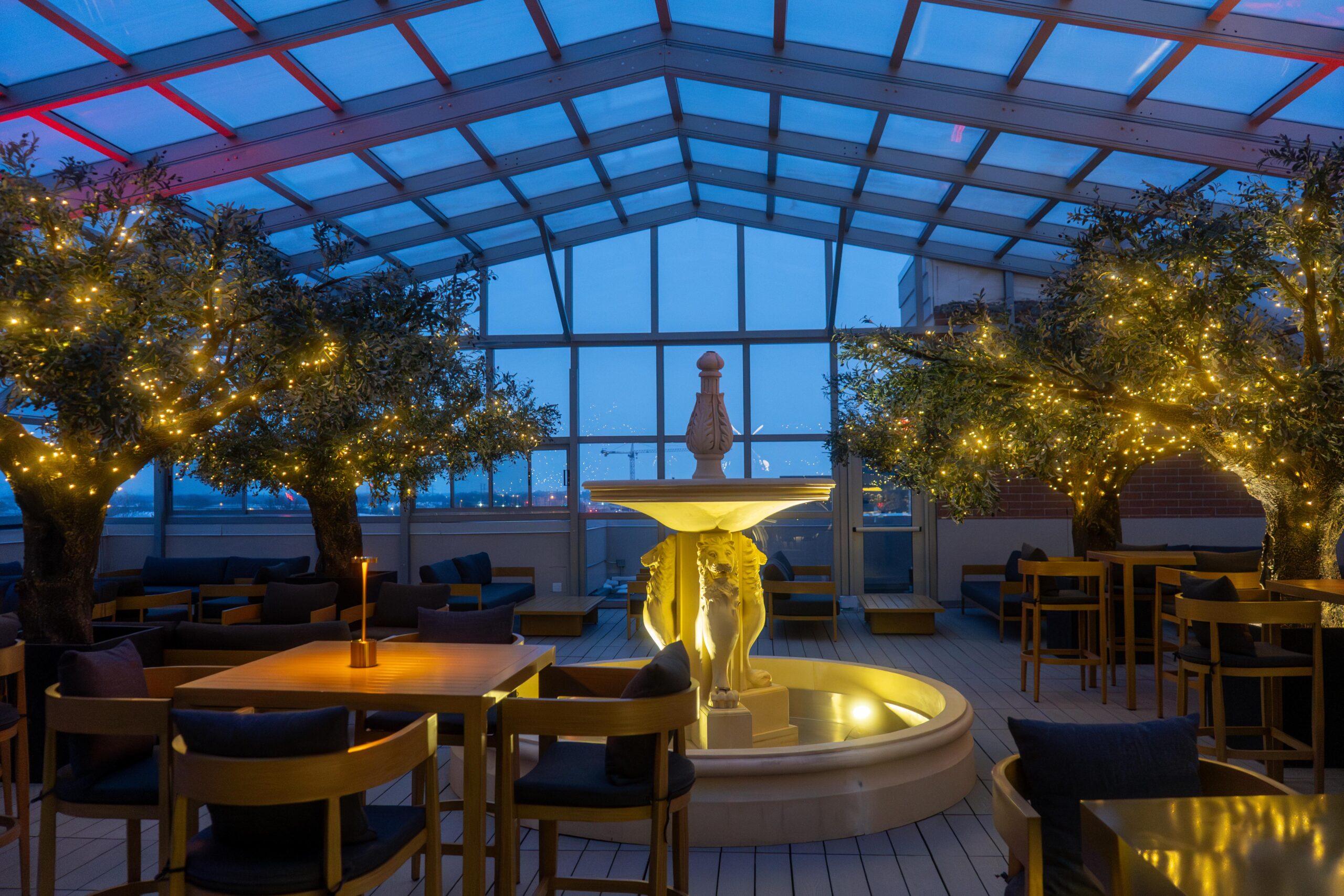 Rooftop patio enclosure at in Arlignton Heights, IL, creating a beautiful and luxurious event space with a stunning view.