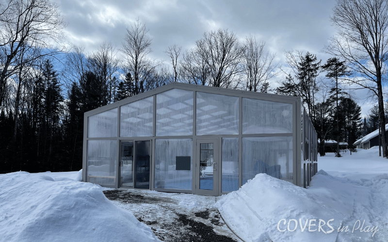 Front exterior view of a fixed single peak pool enclosure in Minden, ON