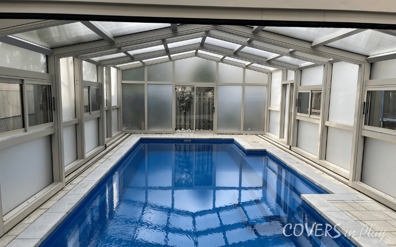 Centered view of a closed pool enclosure with frosted windows in North York