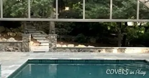 Bi-fold doors open in  pool enclosure