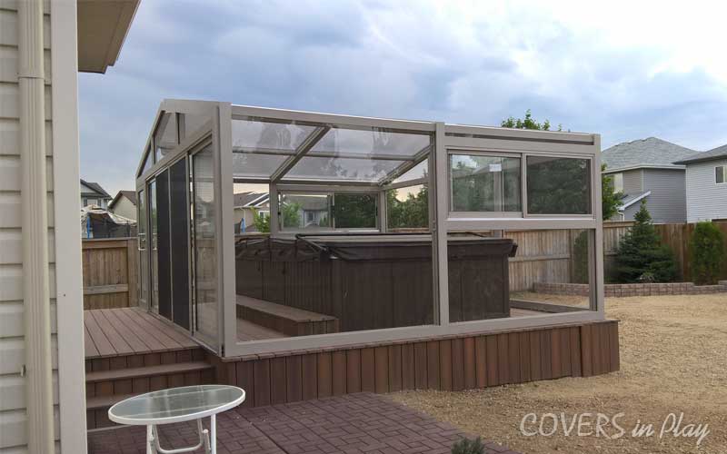 Freestanding swim spa dome in Fort Saskatchewan, AB, with doors
and windows built by Covers in play