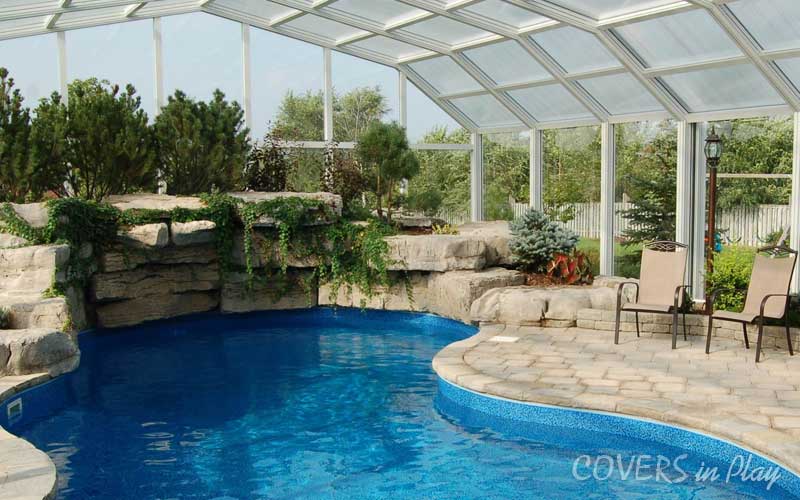  Interior view of pool dome in Sharon, ON, with beautiful landscaping and jumping rock