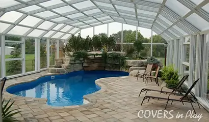 Triple peak retractable pool enclosure closed during cooler days